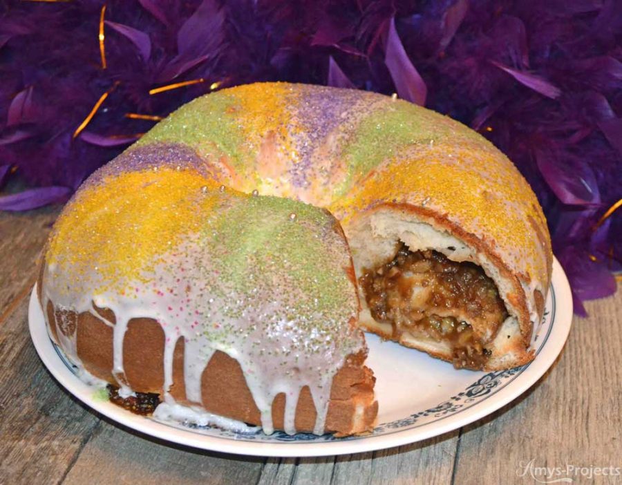 Mmmm delicious homemade King Cake to celebrate Mardi Gras.  This King Cake recipe brings the flavors of NOLA to your kitchen and party.